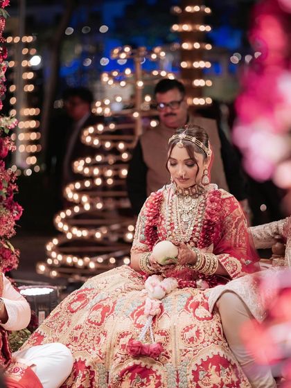 A candid moment from the wedding ceremony. The bride's makeup is designed to last, looking fresh and beautiful throughout the long day of celebrations.