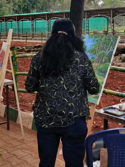 A view from the back, showing me completely absorbed in my work at Lalbagh.