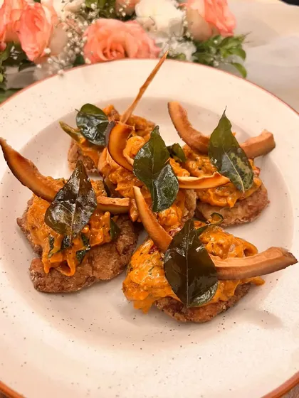 My vegetarian starters are just as exciting as the non-veg options. This is my Kerala Masala Arabi Chaap, where pan-fried colocasia is topped with an onion relish and tempered coconut, offering a unique South Indian flavor.
