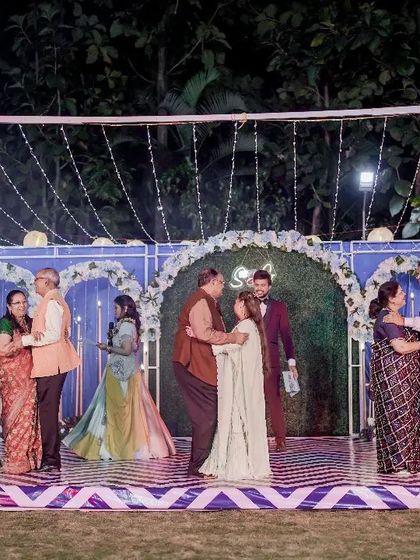 Multiple couples from the family dancing together on stage. This is a wonderful way to showcase the love and relationships within the family.