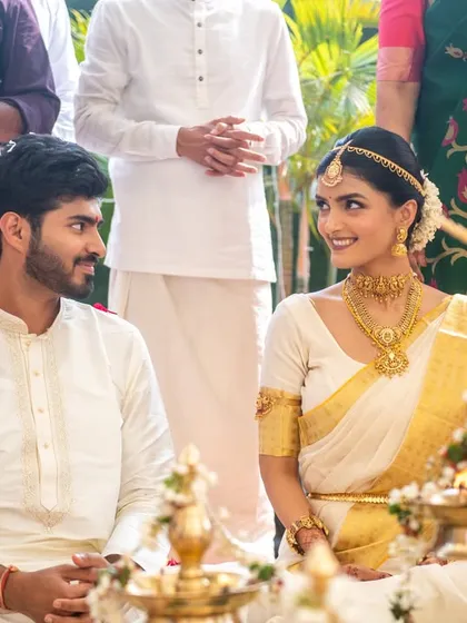 A beautiful candid moment of the couple during their South Indian wedding ceremony.