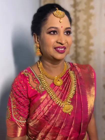 Dr. Bhanupriya's elegant look for a function. We chose a bold magenta lip to complement her beautiful pink silk saree.