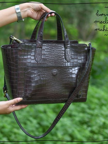 The Medium Mahitha in our luxurious Borneo leather, which features a deep brown color and a classic crocodile-embossed texture for a sophisticated look.