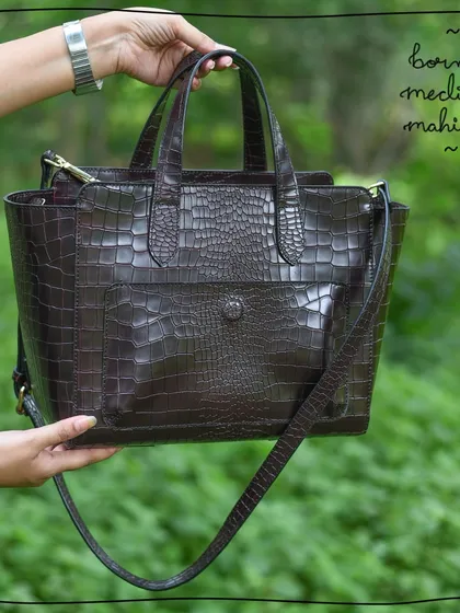 The Medium Mahitha in our luxurious Borneo leather, which features a deep brown color and a classic crocodile-embossed texture for a sophisticated look.