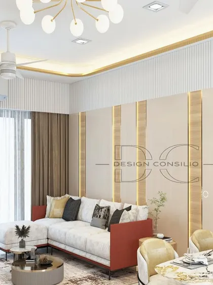 A pop of color can transform a room. In this living and dining space, we used a red and white sectional sofa to create a vibrant, energetic feel, balanced by neutral wall panels with brass inlay details.