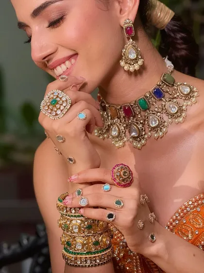 A whole lot of mehendi-meets-sangeet energy. This close-up shows the fresh, peachy warmth on the cheeks and the muted rosy-nude lip, perfect for a vibrant daytime event.