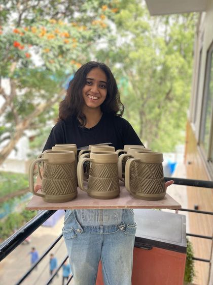 Another shot of Vrinda and her impressive collection of beer mugs.