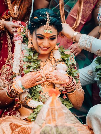 A close-up of a bride's ecstatic smile during a wedding ritual, capturing a moment of pure, unscripted joy.