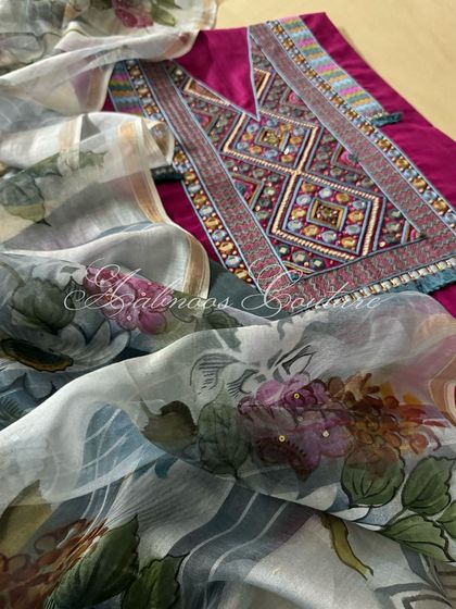 This image captures the beautiful drape of the hand-painted silk chanderi dupatta over the richly embroidered kurta.