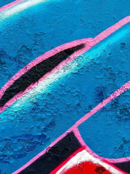 A macro shot focusing on the clean line work and color blending within the graffiti letters. The contrast between the bold black, the soft blue, and the sharp pink outline is a key part of my wildstyle technique.