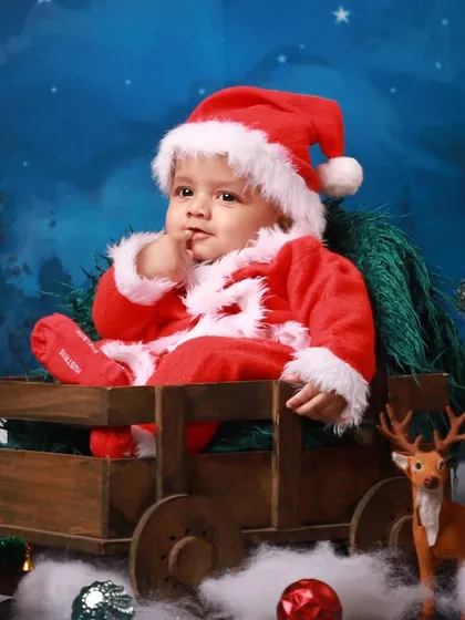 Another adorable moment from the Christmas photoshoot, as this little Santa contemplates the magic of the season. I aim to capture a variety of poses and expressions during each session.