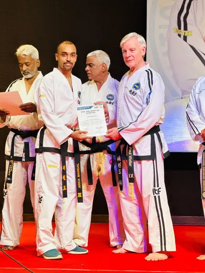 Receiving my Certificate of Completion from ITF President GM Paul Weiler. This certification is a testament to my dedication to continuous professional development as an instructor.