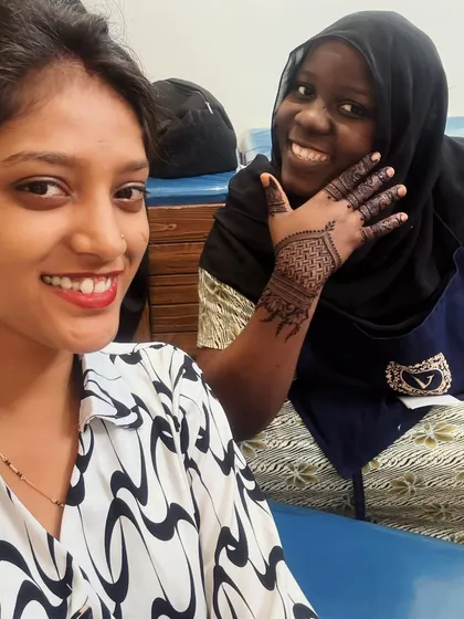 I love working with clients from all over the world. Here I am with a happy client from Nigeria, who wanted to experience traditional Indian henna art.