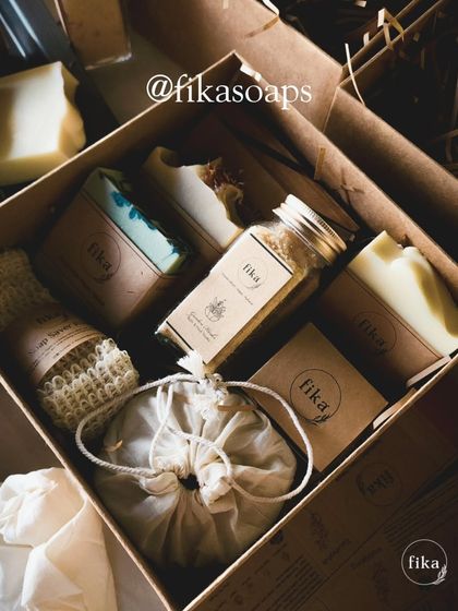 Here is another one of my unique, curated gift sets. This box features a selection of artisan soaps, a soap saver pouch, bath salts, and other small-batch items, all nestled in kraft paper shred for sustainable and beautiful presentation.