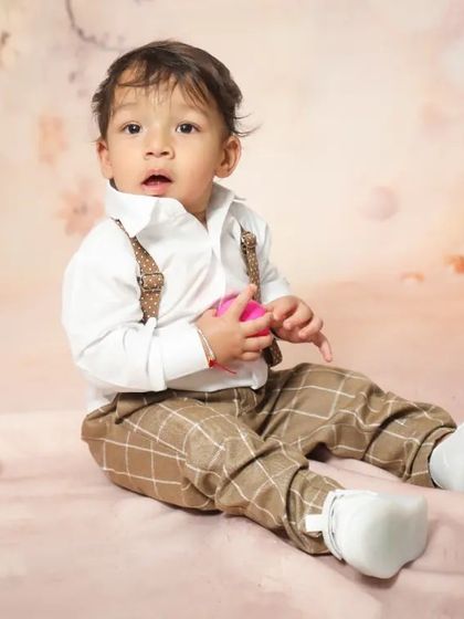 Mr. Handsome! This little boy looks so curious and sweet during his studio portrait session.
