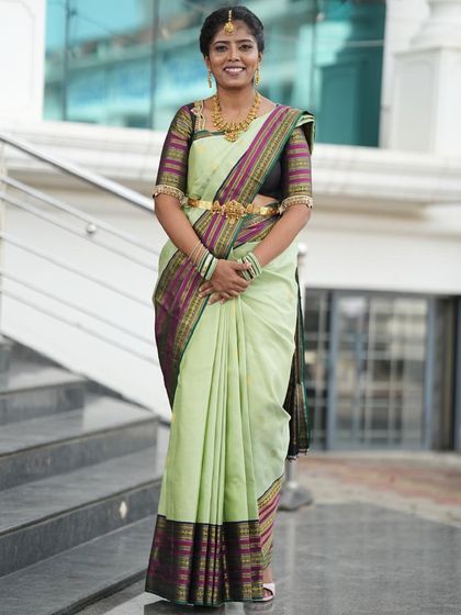 Our client Megha looks stunning in this pista green saree, adorned with a beautiful multi-thread border.
