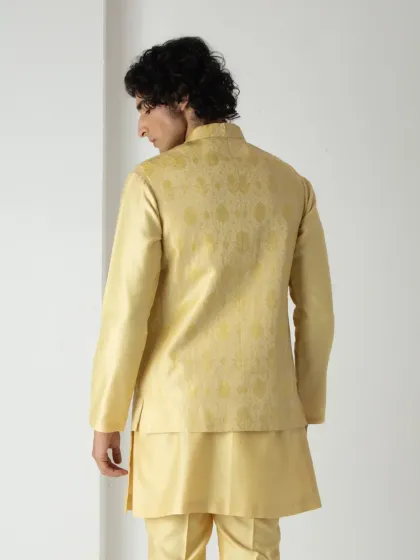The back view shows the clean tailoring and comfortable fit of the yellow kurta and bundi, ensuring you look sharp from every perspective.