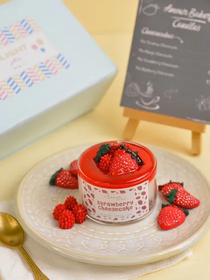 A sweet and classic choice, the Strawberry Cheesecake candle is a vibrant red candle that looks and smells like your favorite dessert.
