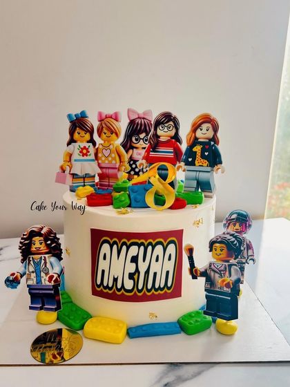 A Lego-themed cake for Ameyaa's 8th birthday, featuring edible Lego figures and blocks.