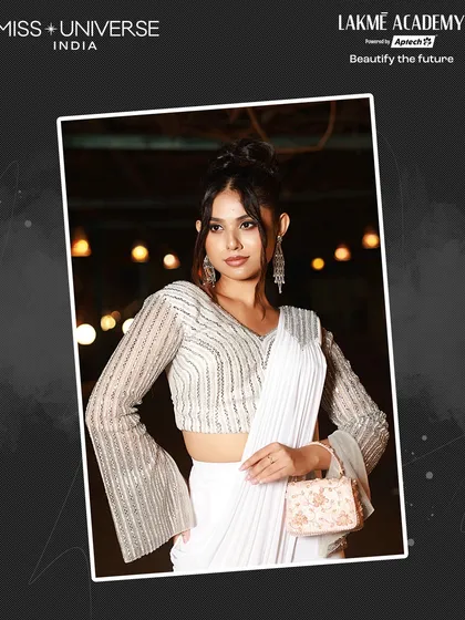 An elegant white saree look with a stylish updo, showcasing my students' ability to create sophisticated and modern hairstyles for high-profile events.