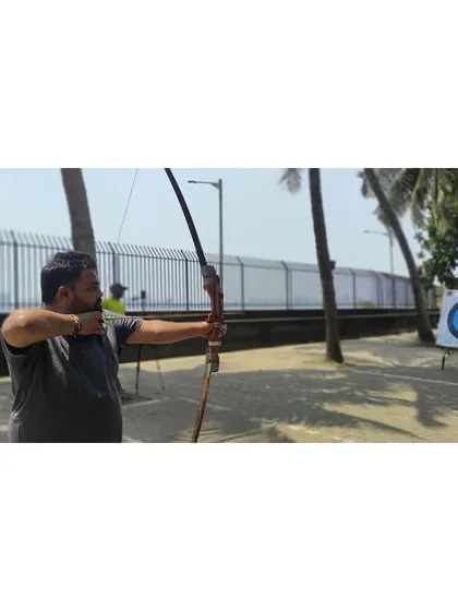 An adult student focusing on his shot. My goal is to help every student find their rhythm and enjoy the sport.