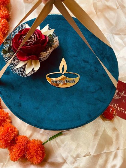 Our round velvet box with convenient carry straps, making it a stylish and portable Diwali gift.