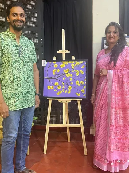 With a fellow art enthusiast in front of my 'Yellove' painting.