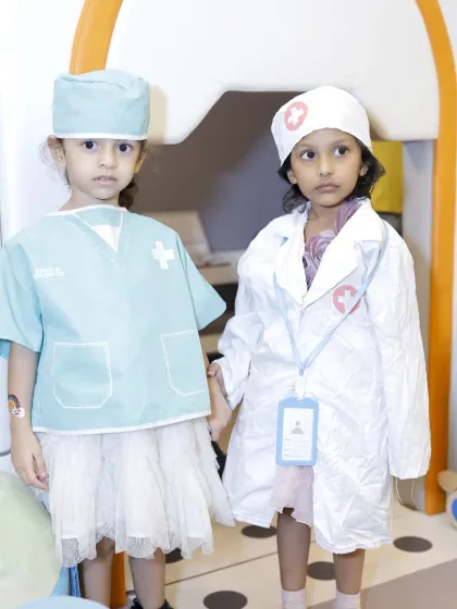 Two little doctors are ready for their patients in our role-playing area, complete with costumes and accessories.