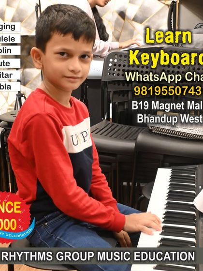 A young student focuses on his keyboard lesson, with his sheet music in front of him. We teach students how to read music, which is a fundamental skill for mastering the piano and keyboard.