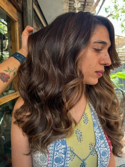 A side view of the 'Espresso' color and cut. The layers and color work together to create a beautiful, voluminous style.
