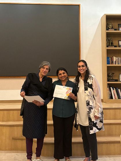 A smiling educator is recognized for completing the intensive leadership course. Her growth contributes directly to our collective ability to better serve children and families.