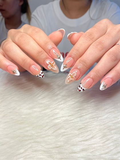 A full view of the mixed-media nail art set, showing the balance between the different designs on each finger.