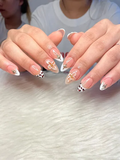 A full view of the mixed-media nail art set, showing the balance between the different designs on each finger.