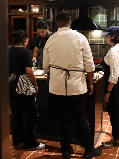 My team observing the plating process. I believe in mentorship and sharing my knowledge of classical techniques with my crew.