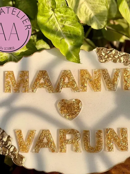 Welcome guests to your home with a personalized nameplate that reflects your style. This elegant white and gold nameplate was a custom piece I created, and I can design one for you with your names and preferred aesthetic.