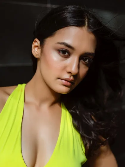 A dewy, sun-kissed makeup look paired with wind-blown hair. The highlighter catches the light beautifully, creating a radiant glow.