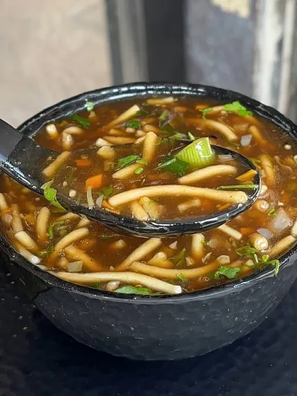 A warm bowl of Manchow Soup is perfect for any weather. It's a flavourful and hearty vegetable soup topped with crispy fried noodles for that extra crunch.