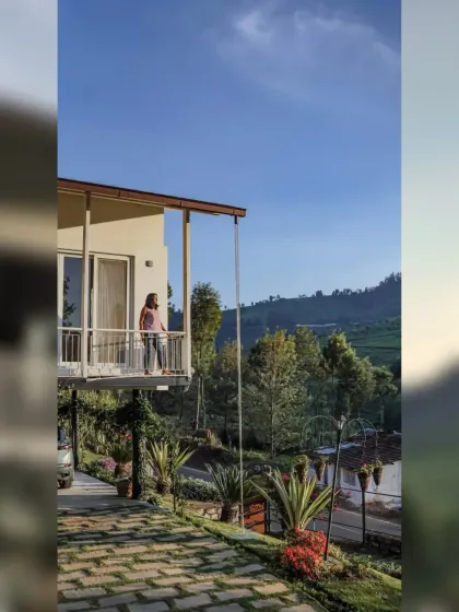 The cantilevered balcony provides a breathtaking, unobstructed view of the Kotagiri valley. This space was designed to feel like it's floating among the trees, offering a quiet spot to slow down and breathe.
