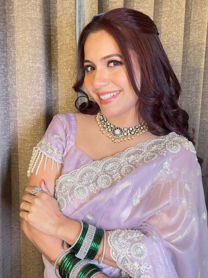 A happy, smiling portrait that shows how comfortable and radiant she feels in her reception glam.