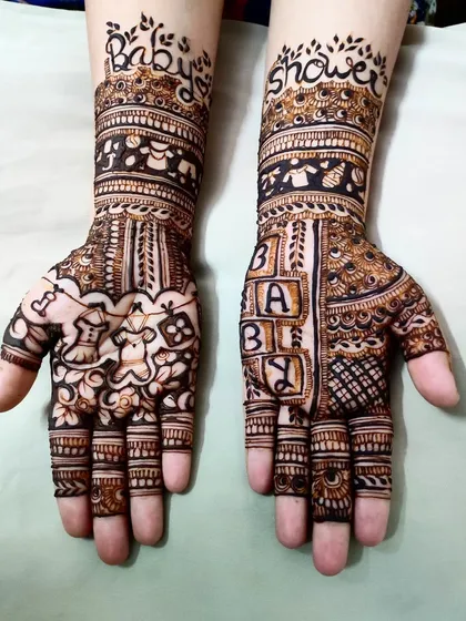 The full view of the baby shower henna, a perfect example of creating themed designs for special occasions.