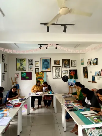 The studio is buzzing with creativity during a CFA class. Students work on various projects across different mediums.