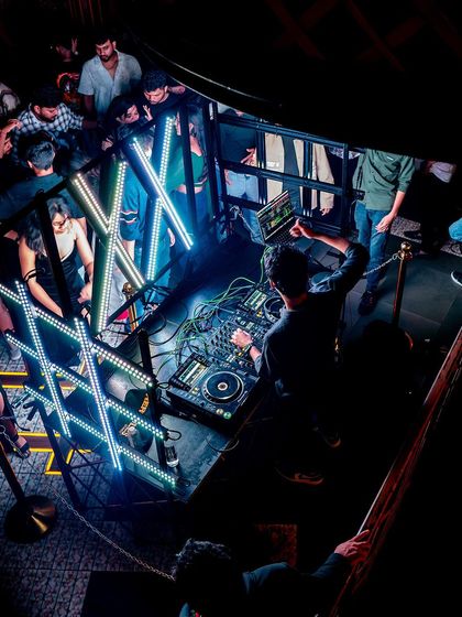 A top-down look at my complex DJ setup with the custom LED 'XX' lights.