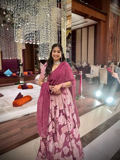 Another look at this gorgeous floral lehenga, perfect for any festive occasion. The rich color palette makes it suitable for both day and evening events.