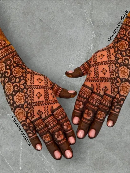 A full and intricate back-hand design featuring a beautiful floral grid pattern. The density of the pattern gives it a rich, fabric-like appearance, perfect for a grand occasion.