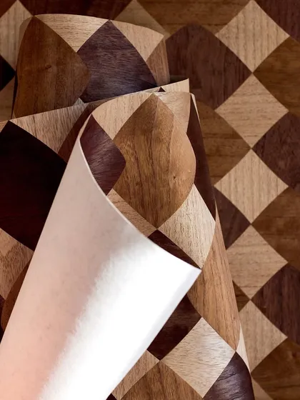 A roll of our checkerboard wood marquetry wallpaper. Crafted by hand, these paper-thin slices of paulownia form an understated yet striking pattern that brings warmth and sophistication to any wall.