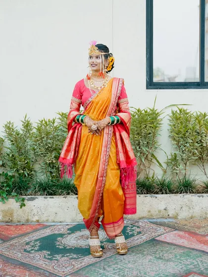 The bride standing confidently in her full Nauvari attire, ready for her wedding day.