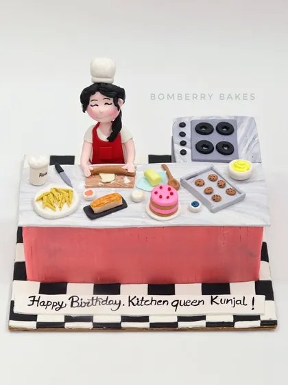 A full view of the adorable kitchen-themed cake.