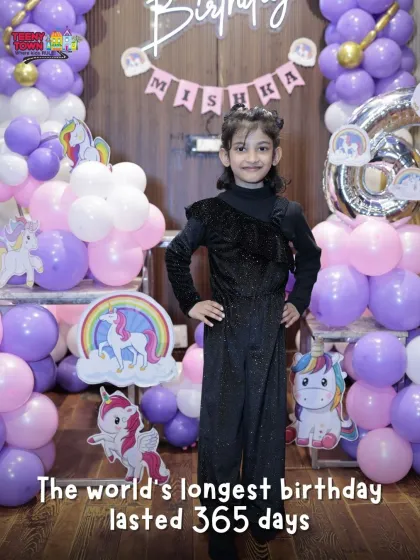 The birthday girl standing proud in front of her unicorn party decor. I make sure every child feels like the center of the universe on their day.