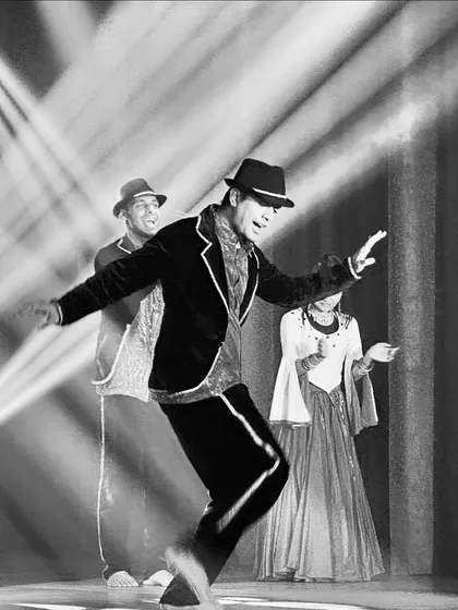 The same stylish performance in a timeless black and white shot. This highlights the classic feel and sharp lines of the choreography, suitable for an elegant wedding theme.