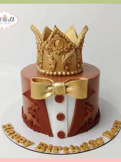 This royal-themed cake is all about power and elegance. The design features a detailed golden crown sitting atop a cake decorated to look like a tuxedo, perfect for a milestone birthday or celebrating a big achievement.